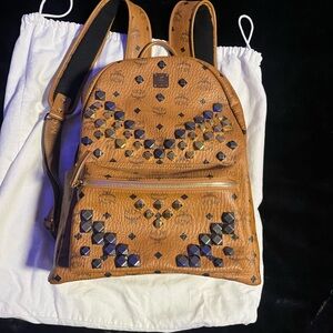 MCM Tan Backpack with Black and Gold Studs